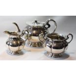 Good silver three-piece tea set of hexafoil fluted melon pattern by Sorley, Glasgow 1923, 49oz.