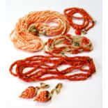 Two coral necklets, another with pearls and other similar items.