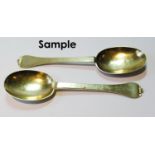Set of eleven silver gilt dessert spoons of trefid rat tail pattern, various, mostly 1697, some