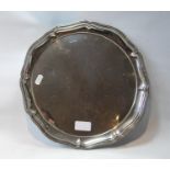 Silver circular tray with octofoil waved fluted edge, on pointed feet, Sheffield 1923, 24oz.