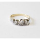Diamond three-stone ring, the largest brilliant approximately .6ct, in gold, '18ct', size R.