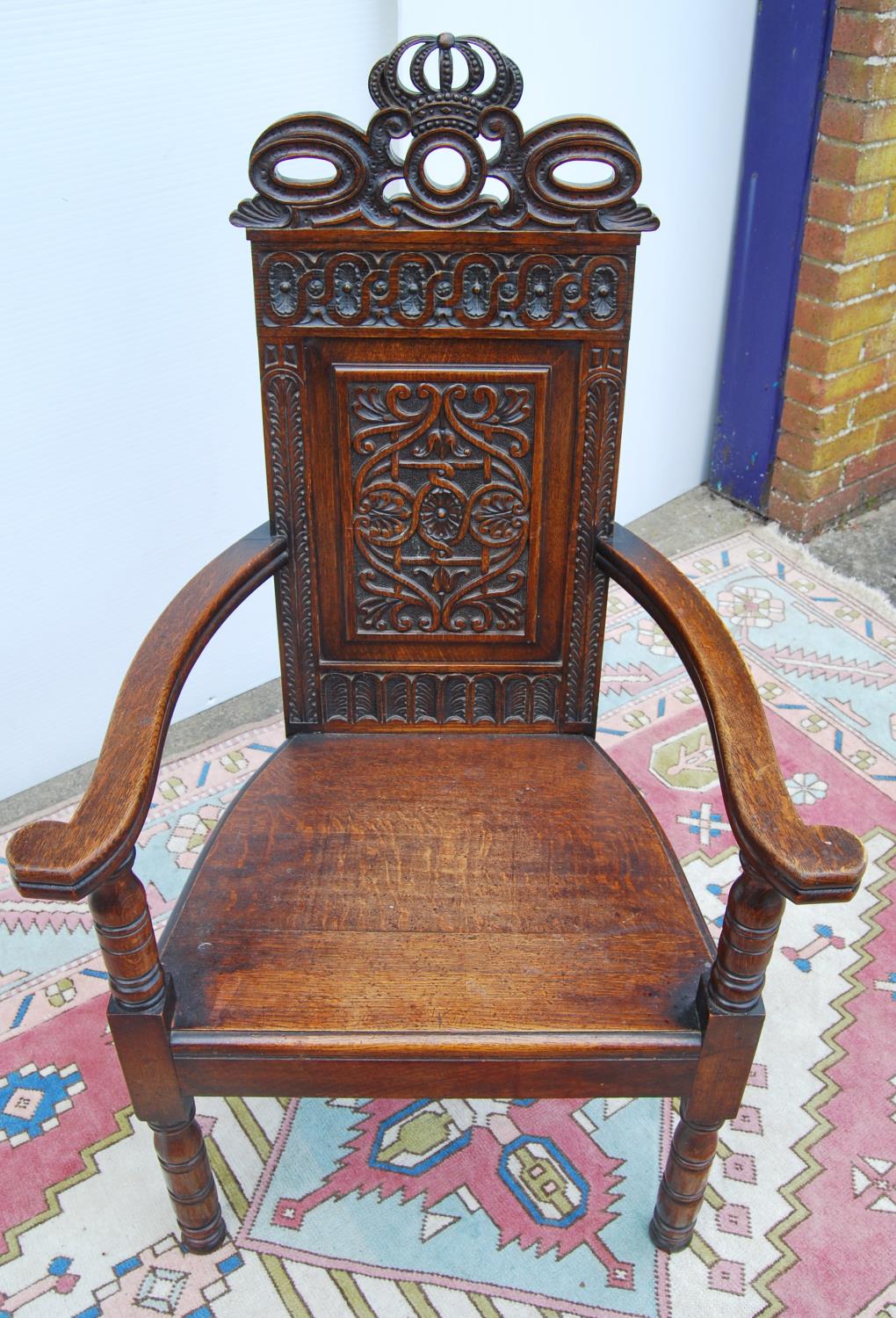 Jacobean-style oak throne chair, with crown carved finial over floral carved back panel, open - Image 3 of 3