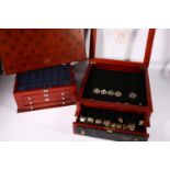 Three Danbury Mint United States of America coin collection cases including the "Never Circulated