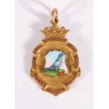 Enamelled 9ct gold fob medal with miniature enamel depicting a pigeon sat on cliff edge, the reverse
