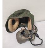 RAF- Cold war period kanvas and rubber flight helmet dated under the H type oxygen face mask Jan