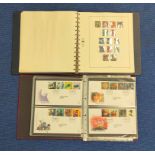 Two postage stamp albums to include an album of Royal Mail first day covers. (2)
