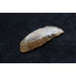 Neolithic- Danish flint sickle of crescent form constructed from faceted amber flint. The