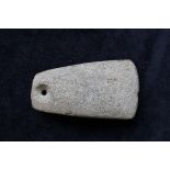 Neolithic- Danish greenstone axe head with pierced butt for the attachment of twine. The implement