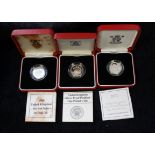 Three .925 silver British piedfort £1 coins with presentation boxes and papers. Dates to include;