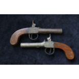 Two 19th century box lock percussion pistols by B. Woodward & son, London, both with broken hammers.
