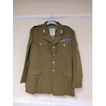 British Army uniform, an olive green jacket with J Compton Sons and Webb Ltd label "SSGT