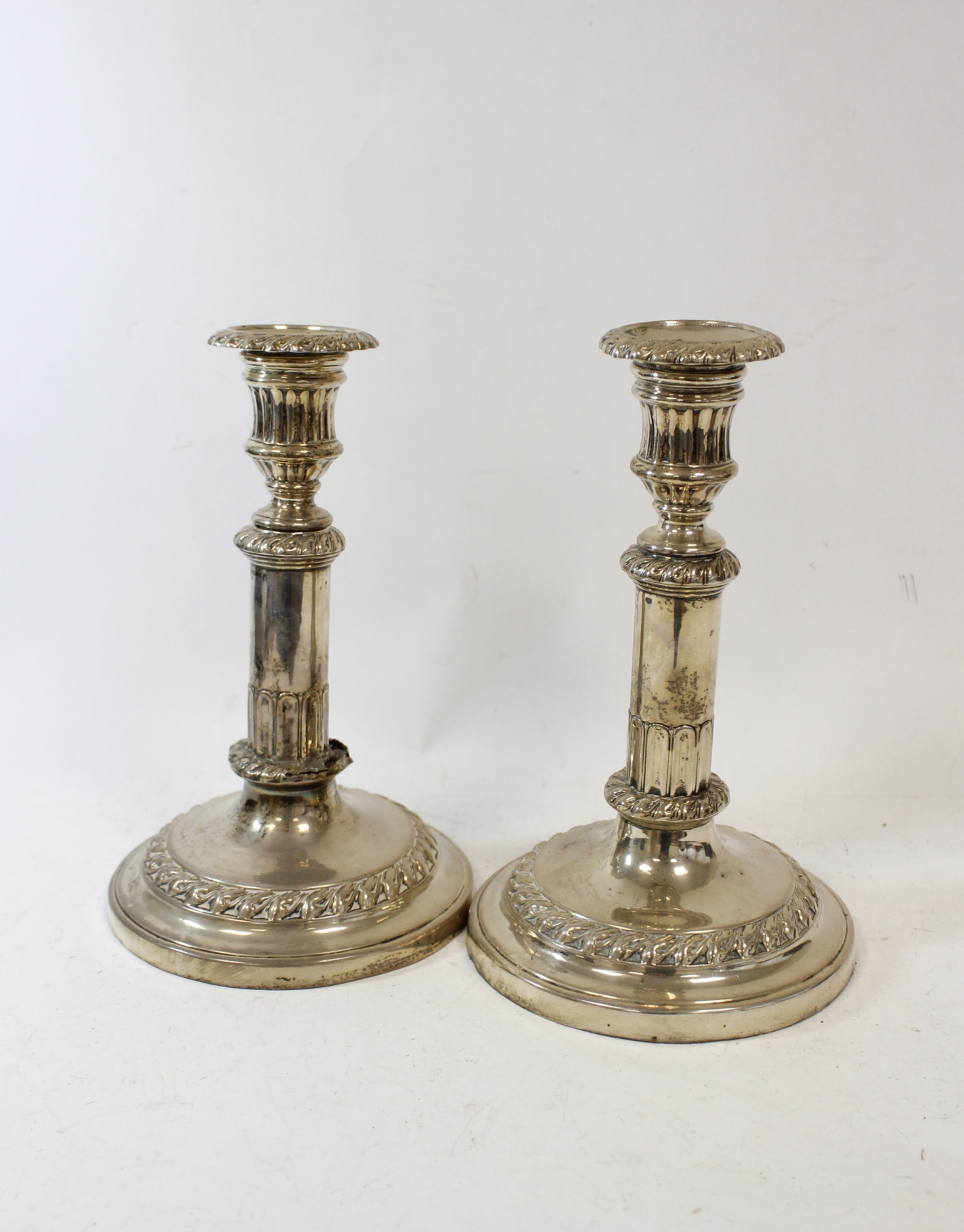 Pair of silver sliding candlesticks with foliate bands by T & J Settle, Sheffield 1819 (one a/f).