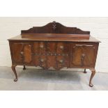 Edwardian mahogany sideboard, the shaped ledge back over two central drawers flanked by cupboards,