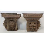 Pair of antique carved wood block capitals, each with two satyr mask heads, foliate egg and dart and