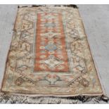 Anatolian Turkish wool rug in predominantly orange, blue and cream, the rectangular field with