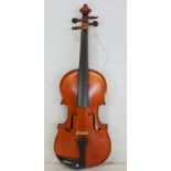 Three quarter size violin with one piece back, no label, cased, with unmarked bow.