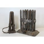 Two 19th century metal candle moulds, one for twelve sticks, 25cm wide, the other for four sticks,