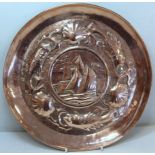 Small Arts & Crafts copper tray with repousse decoration, the central circular panel depicting