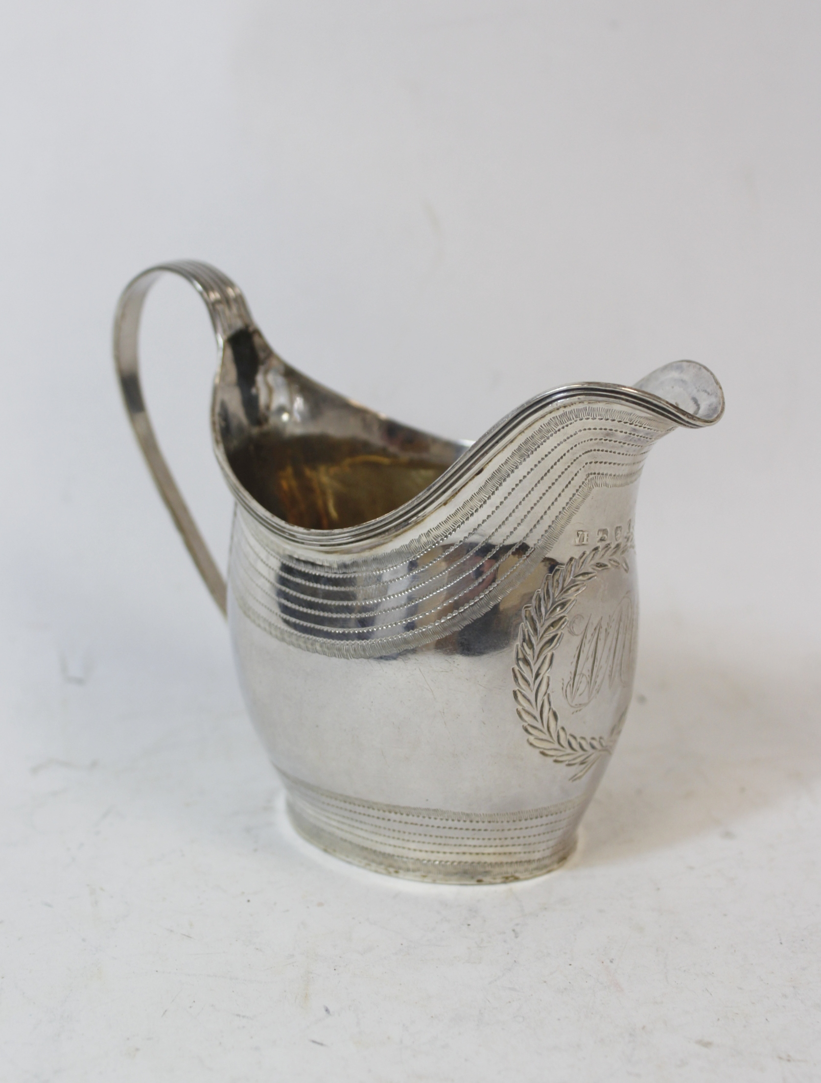 Silver cream jug of ovoid shape with initialled cartouche and pin struck bands by William Hall,