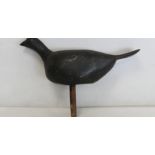 Antique wooden bird decoy with grey painted finish and peg base, 23.5cm high and 31cm long.