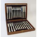 Set of twelve silver fish knives and twelve forks with oval reeded handles by Harrison Brothers,