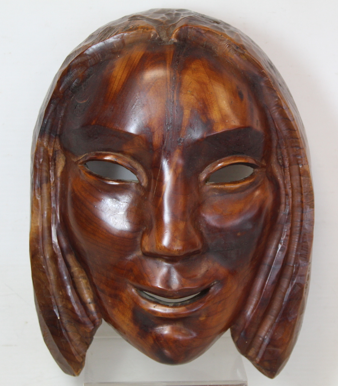 WILLI SOUKOP, R.A. (1907-95).  A carved wooden mask of a girl, signed and dated 1935, 24cm x 18cm.