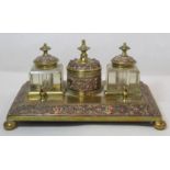 19th century brass and copper desk stand of rectangular form with ball feet, circular covered pot