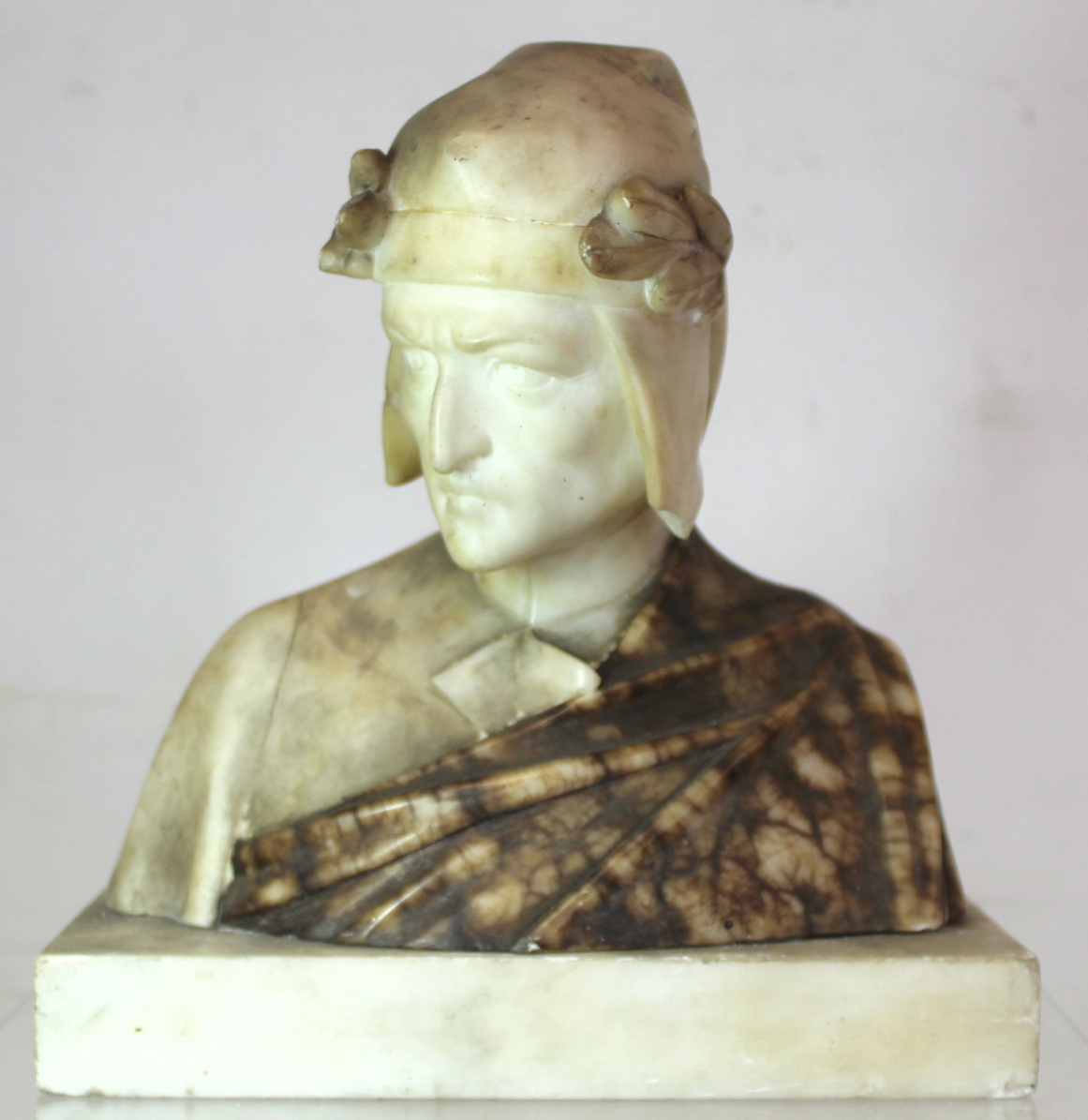 Antique carved alabaster bust of Dante on rectangular plinth base (detached), 23cm high.