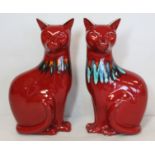 Pair of Poole Pottery red Delphis cats, each 29cm high, each stamped Poole England.  (2).