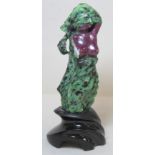 Natural ruby in green zoisite carved figure of an abstract female nude, 14cm high on composite