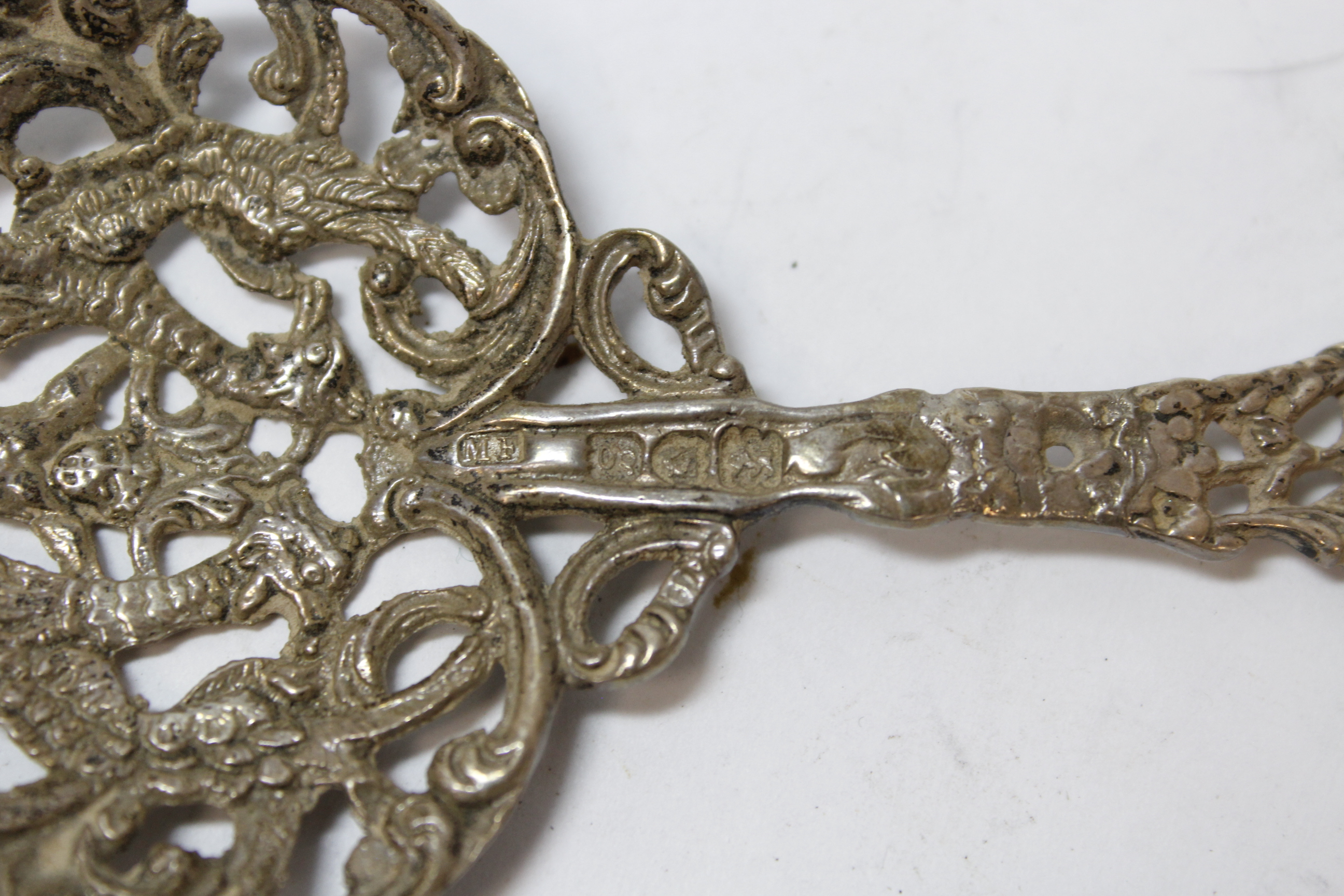 Silver ribbon puller modelled as a lion, 'fantasy' marks; two Chinese spoons and another, (London) - Image 4 of 4