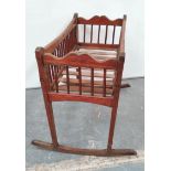 Antique pine cradle or cot with spindle sides on two plain rockers.