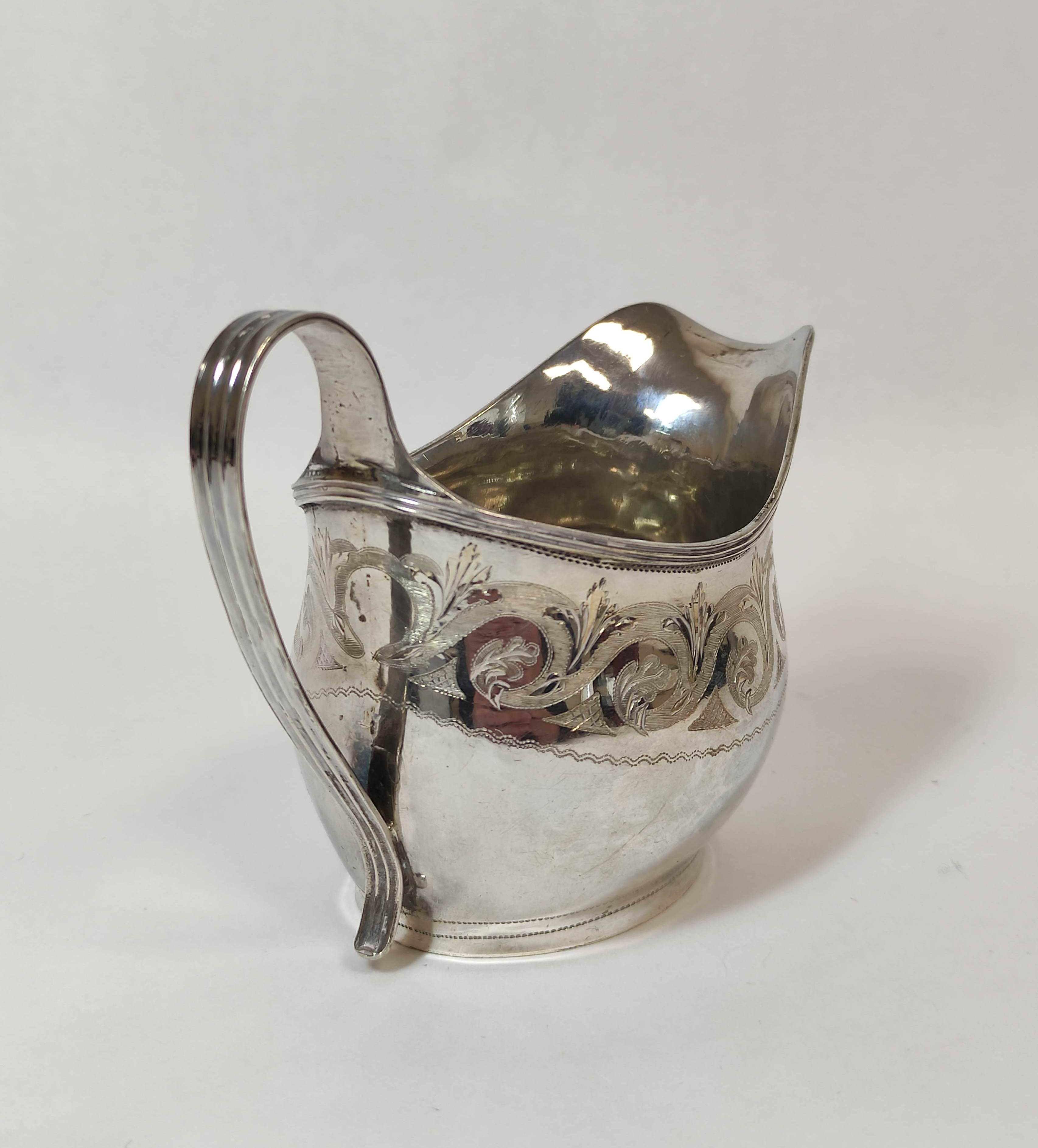 Silver cream jug of ovoid shape engraved with scrolls by P & W Bateman, 1812, 93g. - Image 2 of 5