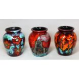 Three Anita Harris Studio Pottery vases of squat baluster form, one decorated with "Potteries