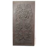 Carved oak panel intricately carved with entwined dog roses, 39cm x 19cm.