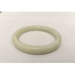 Chinese green hardstone bangle. 6cm central diameter.43.7g