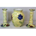 Poole Pottery "Feruccio" pattern vase of baluster form and a pair of matching candlesticks, all 20.