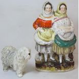 Victorian pottery figure group of two fishwives standing on naturalistic plinth base with basket