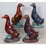 Four Anita Harris Studio Pottery figures of ducks standing on naturalistic oval plinth bases with