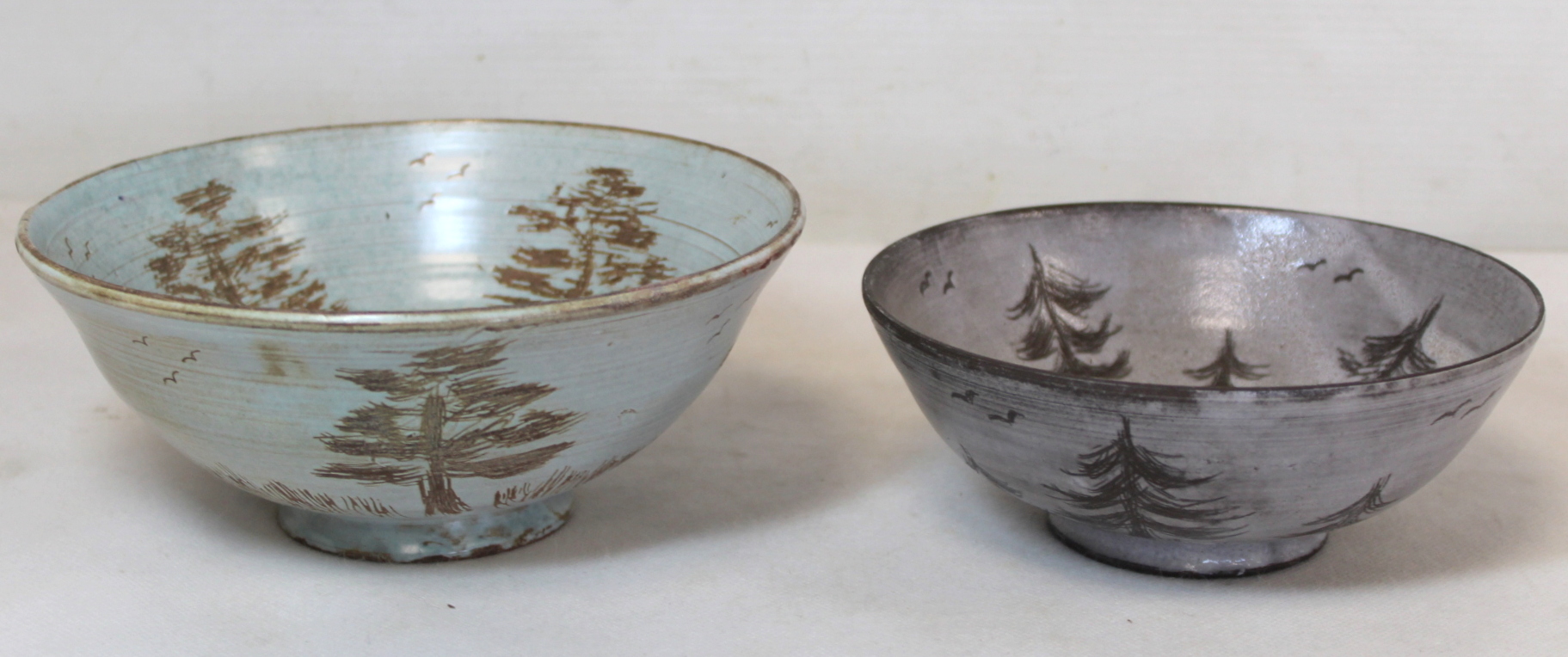 Two studio pottery small circular bowls, both with sgraffito decoration of trees, one with duck