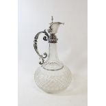 German late 19th century cut glass claret jug of shaft and globe form, with silver mount and knopped