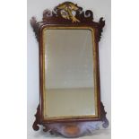 George III style mahogany wall mirror with fret cut frame, gilt slip and bird pediment and inlaid