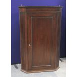 George III mahogany corner cabinet, the dentil cornice over inlaid frieze & single door enclosing