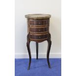 Continental gilt metal mounted cylindrical marble topped chest of four drawers raised on slender