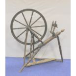 19th century spinning wheel of oak and pine construction raised on turned tripod base, 99cm high,