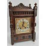 Late 19th century mantel clock by Winterhalder & Hofmeier, chiming on two gongs in carved oak