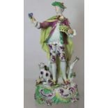 18th century Derby porcelain "Dresden Shepherd" figure, holding a basket of fruit and flowers with