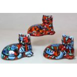 Three Anita Harris Studio Pottery figures of recumbent cats, all with polychrome drip glazed