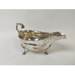 Silver cream boat with cut edge and scroll handle, makers mark not clear, 1794, 3 1/2oz / 114g.