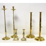 Pair of 19th century tall brass candlesticks with ejectors and dished circular feet, each 45cm high;